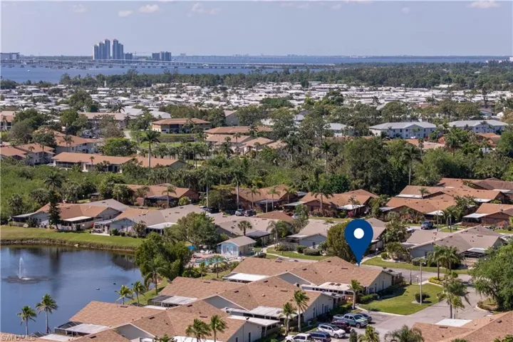Drone / aerial view with a residential view and a water view