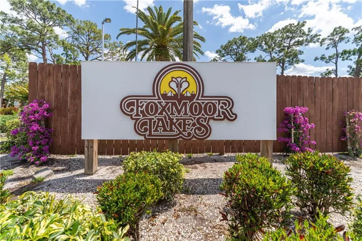Community sign with fence