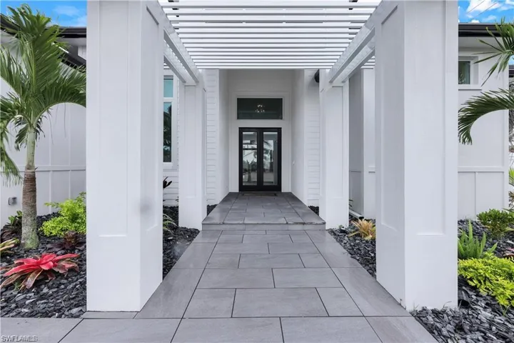 View of exterior entry featuring french doors