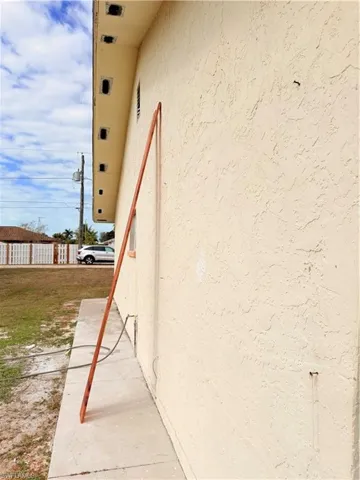 View of side of property with stucco siding