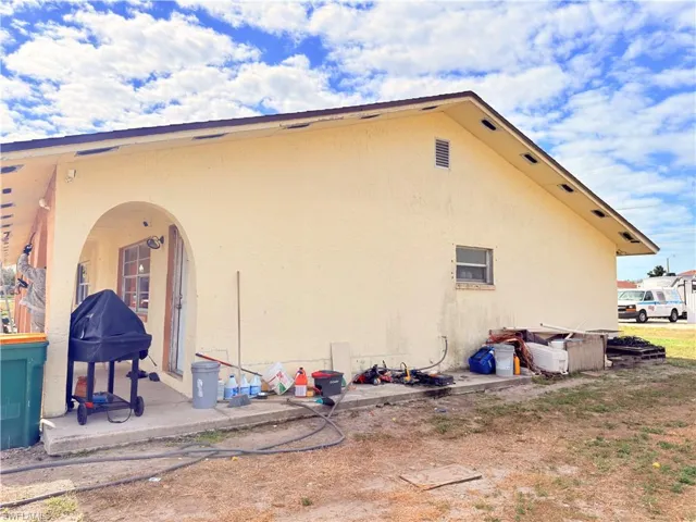Back of property featuring stucco siding