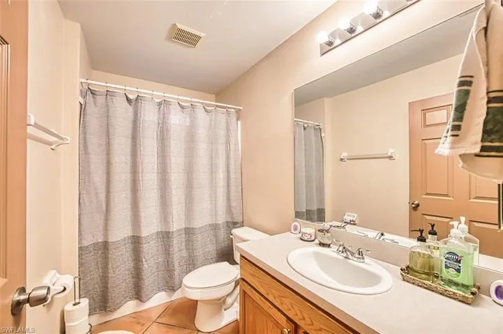 Bathroom featuring vanity and light tile patterned flooring