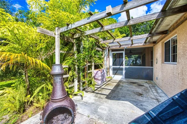View of patio / terrace featuring a sunroom and ceiling fan