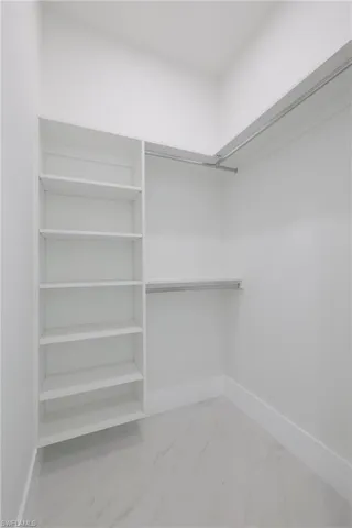 Spacious closet with tile patterned flooring