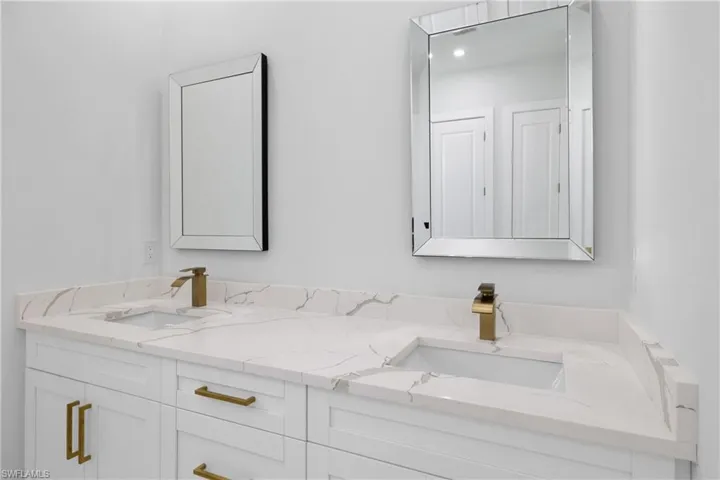 Bathroom featuring dual bowl vanity