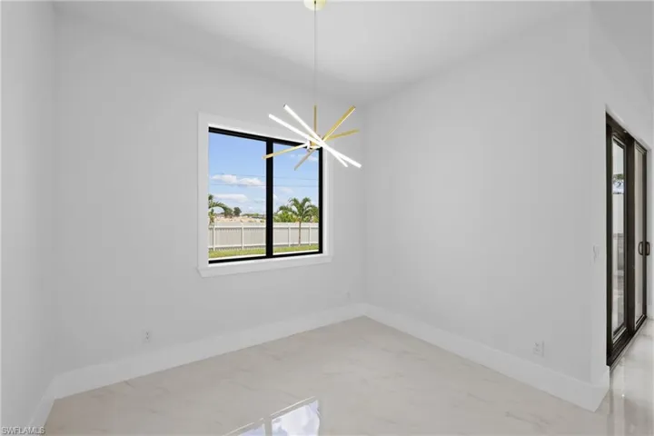 Spare room featuring an inviting chandelier