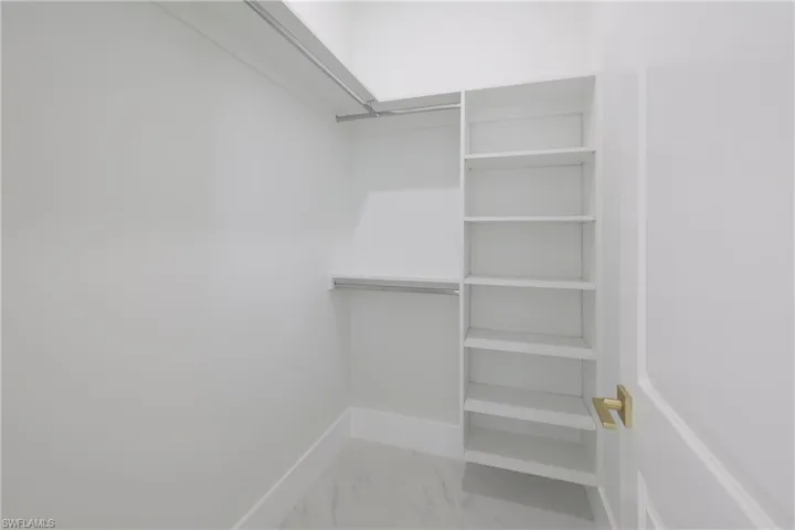 Walk in closet featuring tile patterned floors
