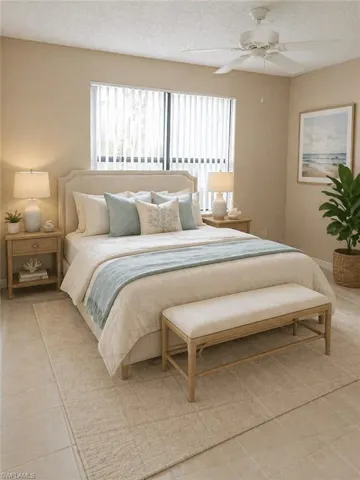 Spacious room featuring neutral wall tones, large window with vertical blinds, ceiling fan, and tile flooring