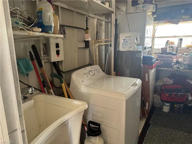 Laundry area featuring washer / dryer and electric panel