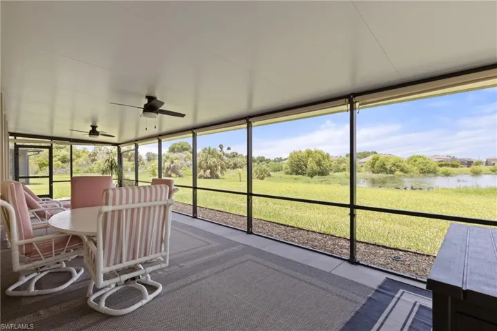 Sunroom / solarium featuring ceiling fan