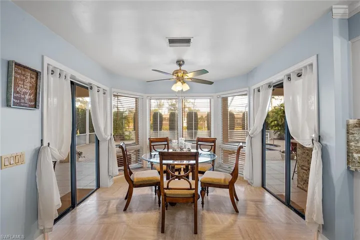 Dining space with baseboards and a ceiling fan