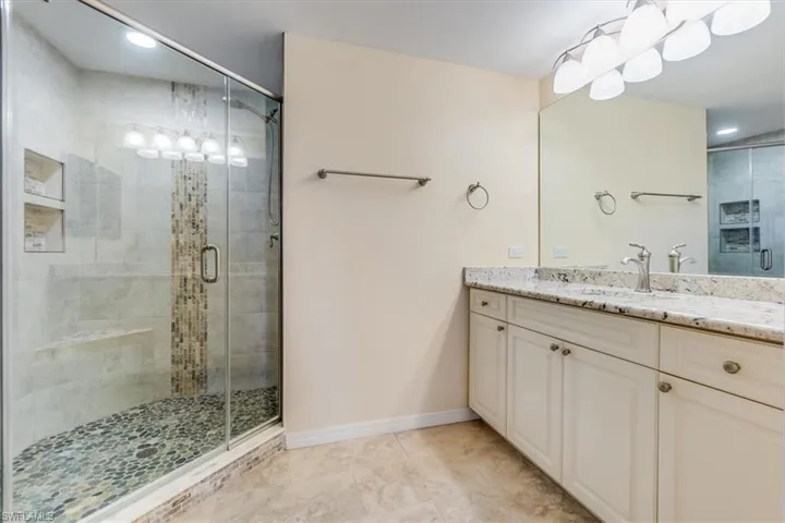 stylish walk-in shower with generous counter space