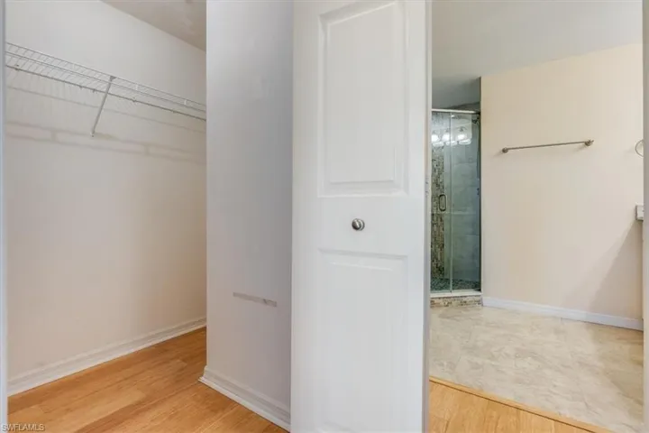 Roomy walk in closet in primary bedroom