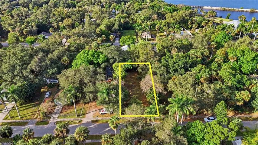 Aerial overview of property's location with a large body of water