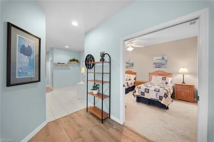 Bedroom with light wood-type flooring, recessed lighting, and ceiling fan
