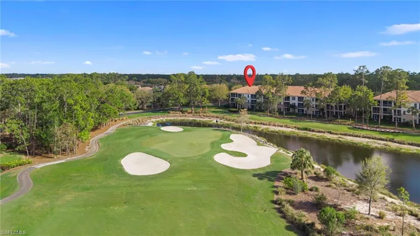 View of property's community with a water view, view of scattered trees, and golf course view