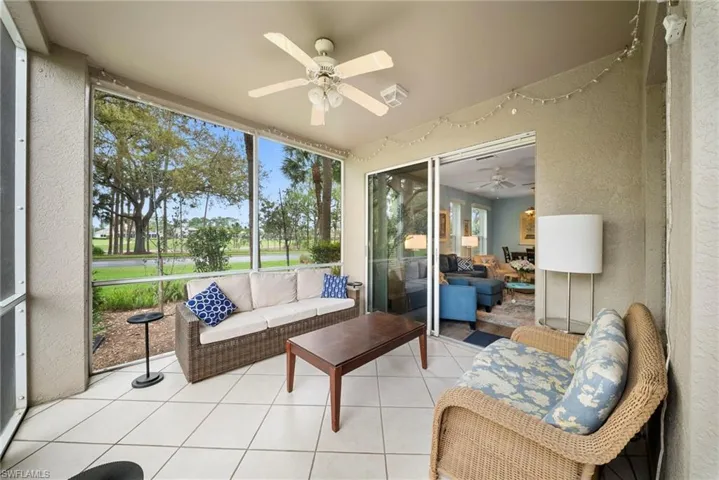 Sunroom / solarium with ceiling fan and an outdoor living space