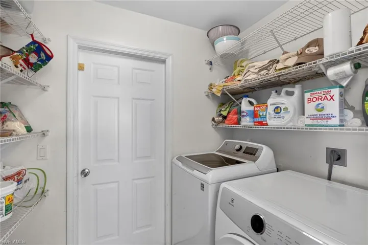 Laundry area with washer and clothes dryer