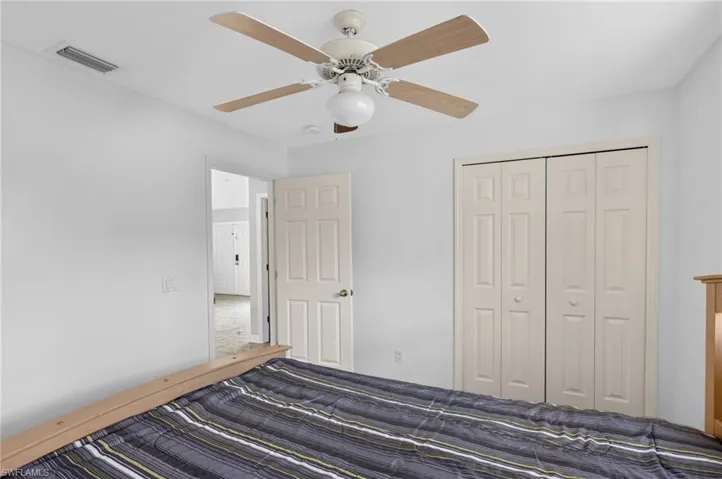 Unfurnished bedroom with a closet and ceiling fan