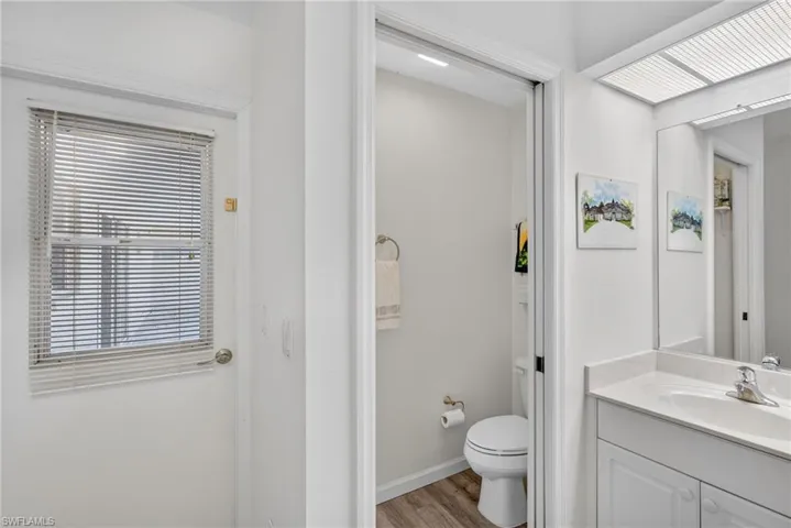 Bathroom featuring vanity and light wood-style floors
