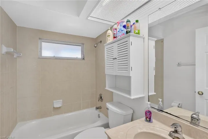 Full bath featuring vanity and shower / bath combination