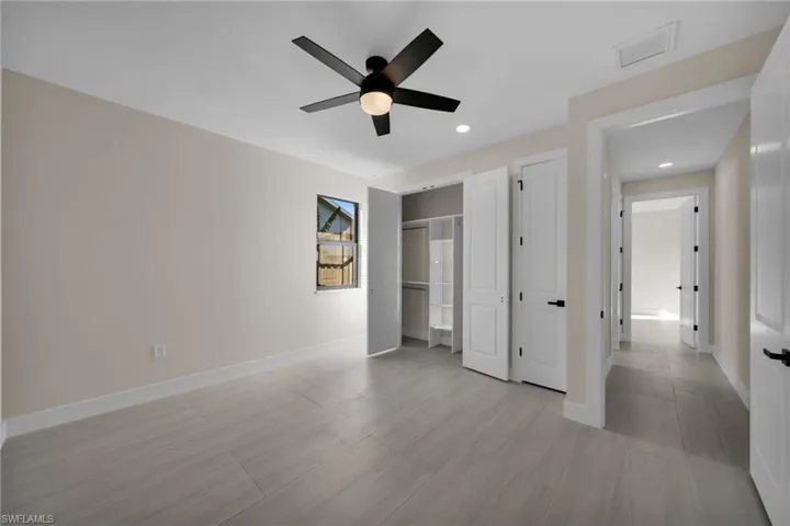 Unfurnished bedroom with ceiling fan, a closet, and recessed lighting