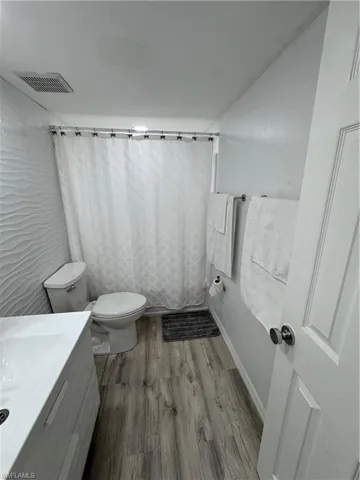 Bathroom featuring vanity and light wood-style floors