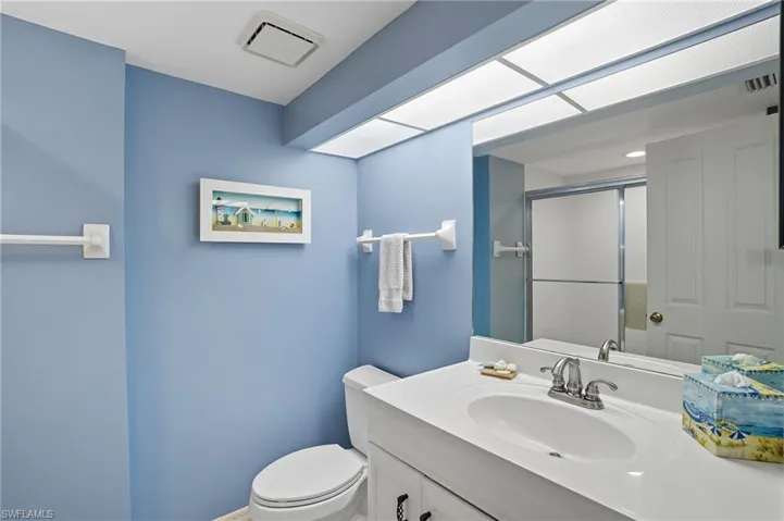 Bathroom with vanity and a stall shower - Virtually Edited Image