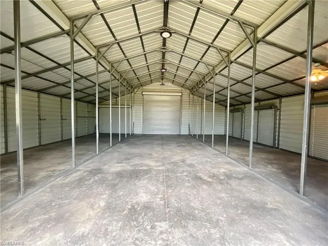 Garage featuring metal wall