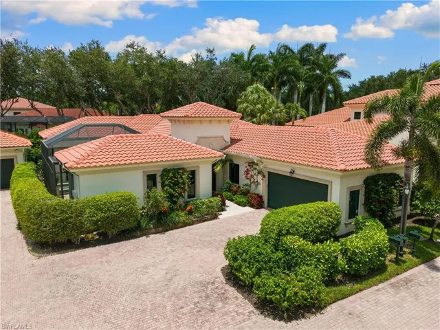 Mediterranean / spanish-style home with a garage