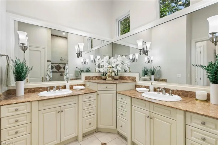 Bathroom featuring dual vanity and tile flooring