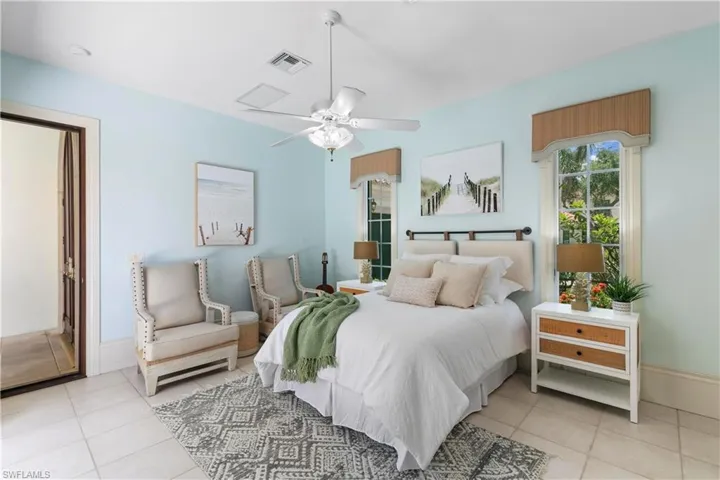 Tiled bedroom with ceiling fan
