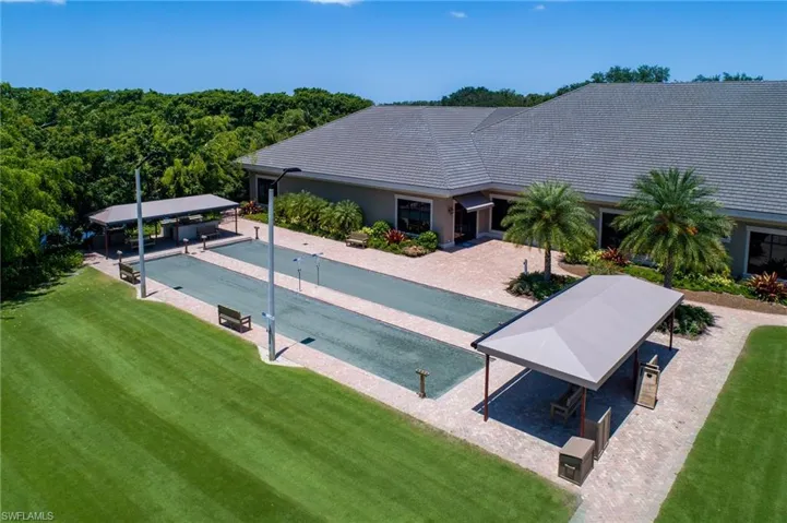 View of pool with a yard