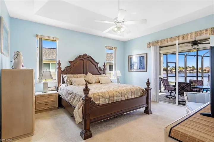 Primary Bedroom with slider to pool