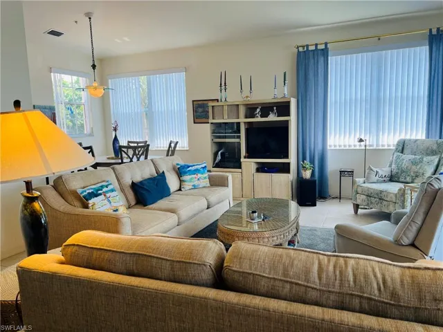 Living room featuring light tile floors