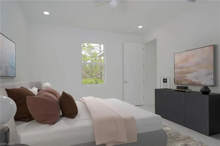 Tiled bedroom featuring ceiling fan