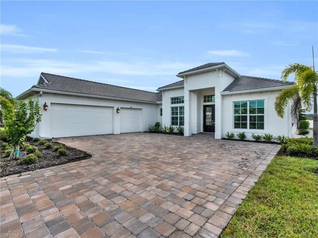 View of front of property featuring a garageVirtually enhanced