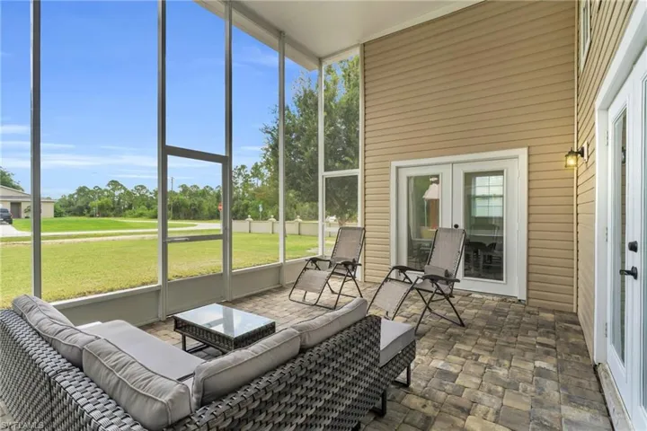 Sunroom with french doors and a healthy amount of sunlight