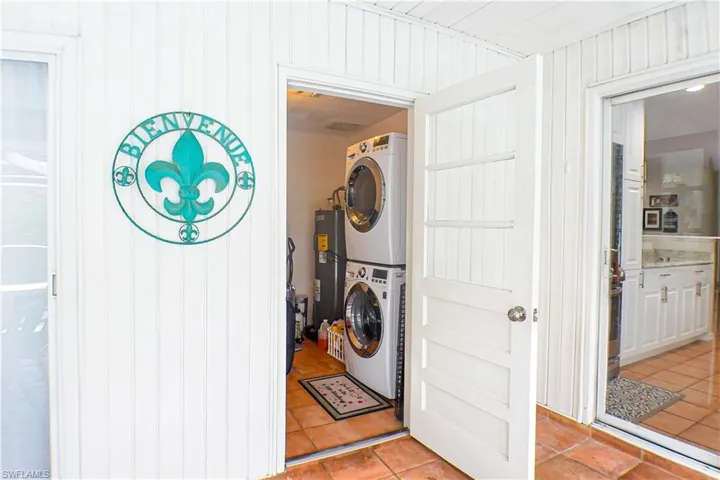 Laundry room featuring stacked washer/dryer