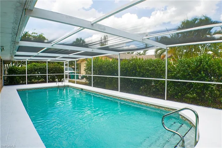 View of swimming pool with screen enclosure