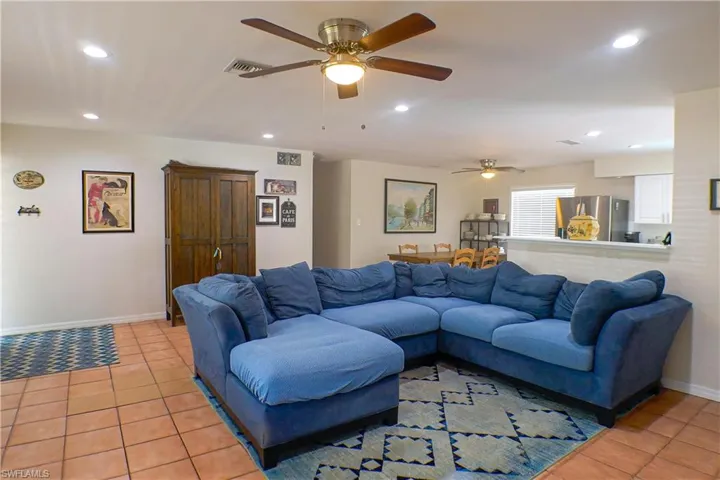 Tiled living room with ceiling fan