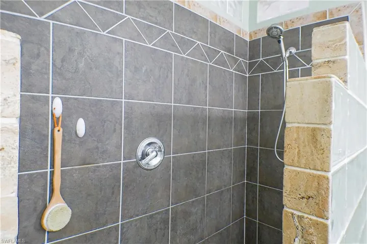 Bathroom featuring a tile shower