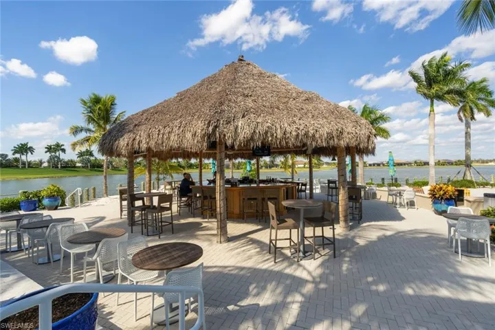The tiki bar is a popular spot to meet and enjoy time with neighbors, family, and friends. It is located outside the Island Club next to the pool and lake front beach.