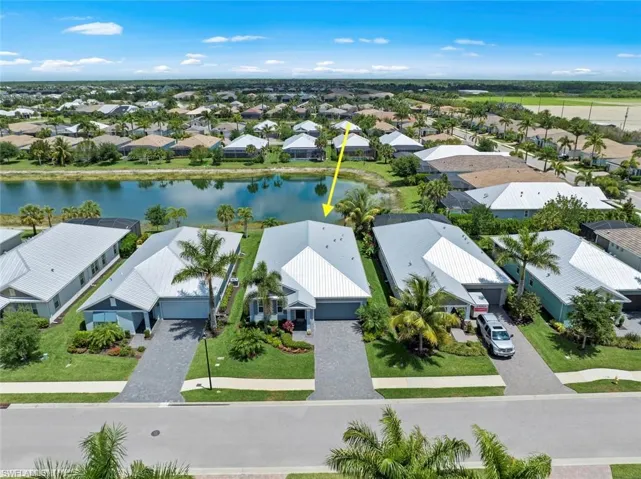 WELCOME HOME! Well maintained WATERFRONT home in Naples Reserve with 4 bedrooms, 3 full baths, 2143 square feet under air and a total of 2989 square feet.