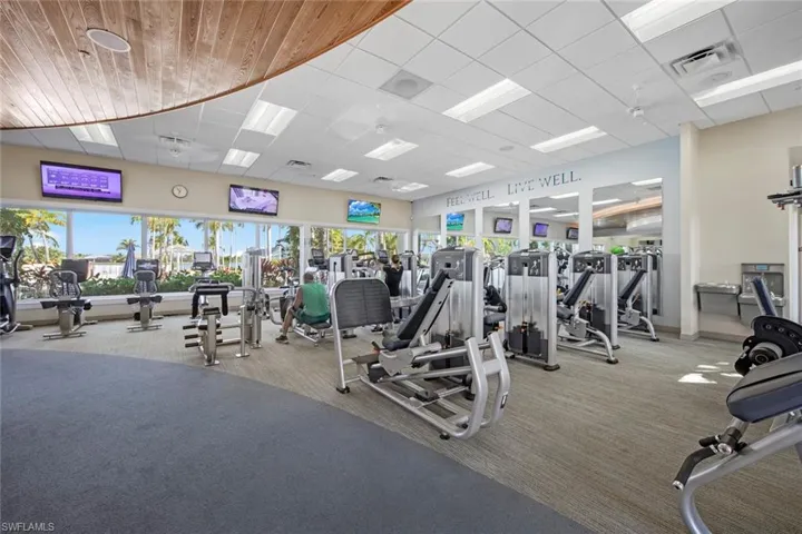 Exercise Room - The fitness center offers free weights, treadmills, stair stepper, rowing machine, elliptical machines, bikes, weight machines and separate yoga room.