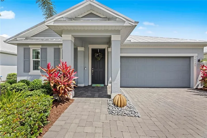 Large inviting entry with STAGGERED TILE FLOOR. Large 2-car garage with EPOXY GARAGE FLOOR, garage door opener, garage KEYPAD ENTRY, and NEW GARAGE STORAGE CABINETS (July 2021)