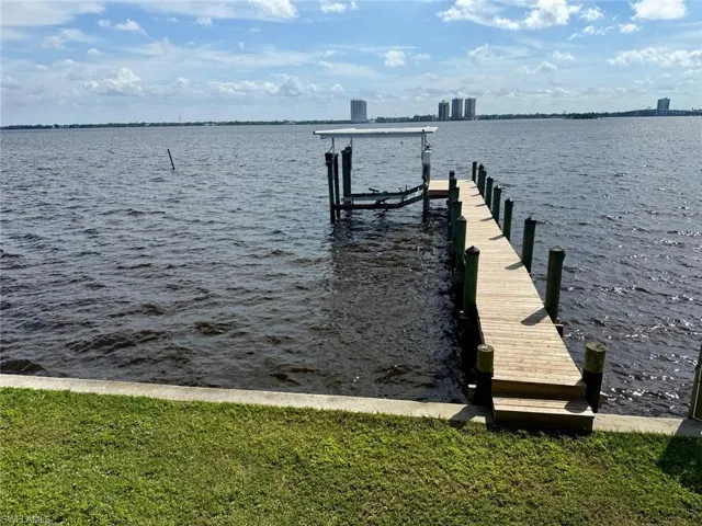 Dock area featuring a water view and boat lift
