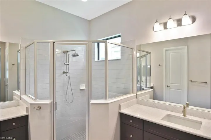 The Primary Ensuite' has a large walk-in glass enclosed shower