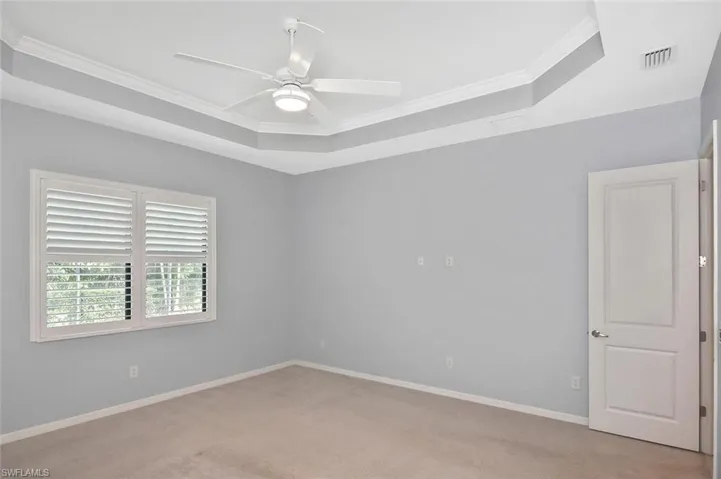 Large window in the Primary offer views of the Lanai, pool, and preserve