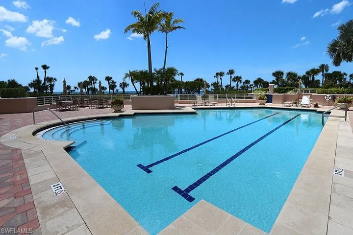 Community pool with a patio
